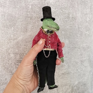 Crocodile is the director of the circus. Textile interior doll in vintage style.