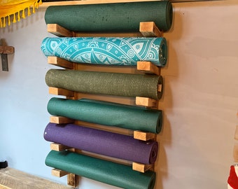 Yoga studio wall hanging yoga mat holder