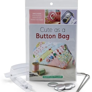 May include: A kit for making a cute button bag. The kit includes all the hardware needed, including cover buttons, internal wire frames, and a zipper. The bag is made of patchwork fabric with a pink, blue, and green color scheme. The kit also includes instructions for making the bag.