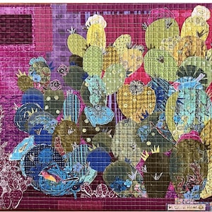 May include: A quilted artwork featuring a cluster of stylized cacti in shades of green, blue, and yellow against a pink and purple background. The design includes floral and geometric patterns, with a small bird in a nest. The artwork is signed "Laura Heine".