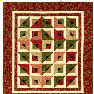 May include: A quilt pattern titled "Radiant" by Cozy Quilt Designs. The quilt design features a square pattern with red, green, and beige geometric shapes. The border is a red floral print. The pattern includes baby, throw, twin, queen, and king sizes.