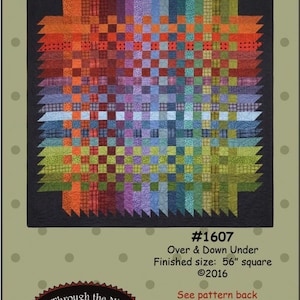 May include: Quilt pattern design titled "Over & Down Under" by Bonnie Sullivan. The pattern is for a 56-inch square quilt and features a colorful patchwork design with a variety of fabrics.