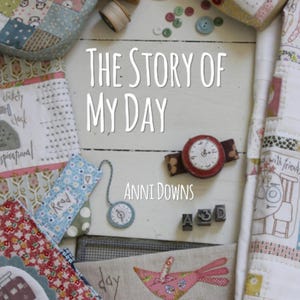 May include: A collection of handmade fabric items, including a book titled "The Story of My Day" by Anni Downs, a watch, and various sewing notions. The image features a patchwork design with a variety of colors and patterns, and the text "Read".