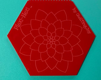 May include: Red plastic hexagon-shaped quilting template with a flower design and the text "Plex-Hex" and "by quiltingjoy".