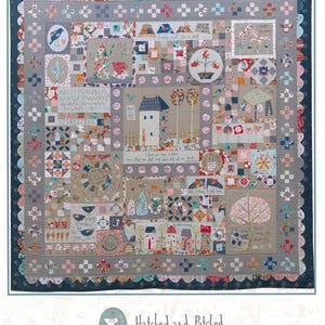 May include: A patchwork quilt with a homespun theme, featuring the text "WHERE WE LOVE IS HOME." The quilt showcases various embroidered squares with houses, trees, birds, and floral motifs in muted tones of beige, blue, and pink.