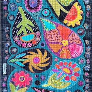 May include: A colorful, quilted textile featuring a paisley design with various shapes and patterns. The quilt showcases a vibrant mix of colors, including teal, pink, orange, and yellow, with intricate details and a dark blue border.