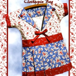 May include: A Wash Day Clothespin Bag by Darlene Zimmerman shaped like a dress with a sailor collar, red bow, and pleated skirt. The fabric features a repeating pattern of vintage irons and laundry motifs in red, white, and blue color schemes.