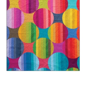 May include: A colorful quilt titled "ORIANA" by Alison Glass, featuring large, striped circles in various colors like yellow, pink, blue, and green. The quilt measures 60 x 60 inches.