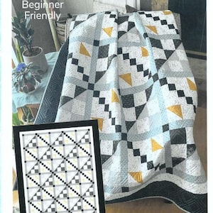 May include: A quilt pattern titled "Diamond Mist" with a geometric design in black, white, and yellow. The quilt is draped over a chair. The image also includes a framed example of the quilt pattern and the text "Beginner Friendly".