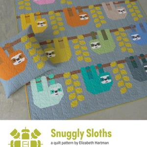 May include: A quilt and pillow set featuring a repeating pattern of colorful sloths hanging from branches. The sloths are in various colors, including pink, orange, and green, against a light blue background. The text "Snuggly Sloths" is visible.