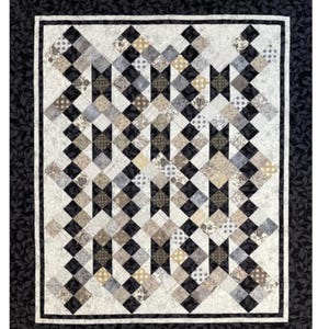 May include: A quilt pattern with a geometric design in shades of black, white, and tan. The quilt features a repeating pattern of diamonds and squares, framed by a black border with a leaf pattern. The text "Simply Tranquil" is displayed.