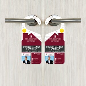 May include: A red and white door hanger with a house illustration and the text "Homeservices of America" and "Buying? Selling? I can help. With all of your real estate needs."  The hanger also features a photo of a woman with the text "Elena Alex" and a phone number.