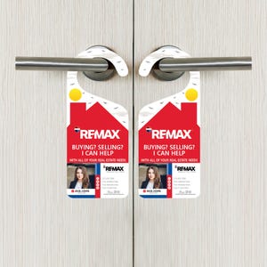 May include: A red and white door hanger with the text "RE/MAX" and "Buying? Selling? I can help. With all of your real estate needs."  The hanger features a photo of a woman with the text "Ava John" and a phone number.