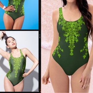 May include: A green one-piece swimsuit with a leafy pattern. The swimsuit has a scoop neck and a racerback style. The model is wearing the swimsuit on a beach.