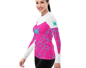 May include: A pink and white long-sleeved shirt with a spider web design and a blue spider graphic.