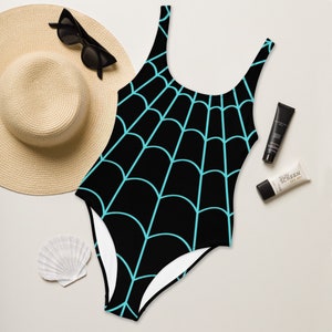 May include: Black swimsuit with a turquoise spiderweb pattern.