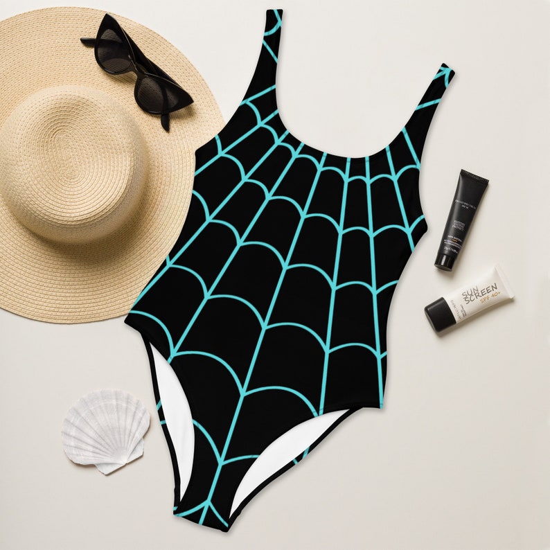 May include: Black swimsuit with a turquoise spiderweb pattern.