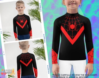 May include: Black long-sleeve shirt with a red spider web design and a red spider graphic. The shirt has a mock neck and long sleeves.