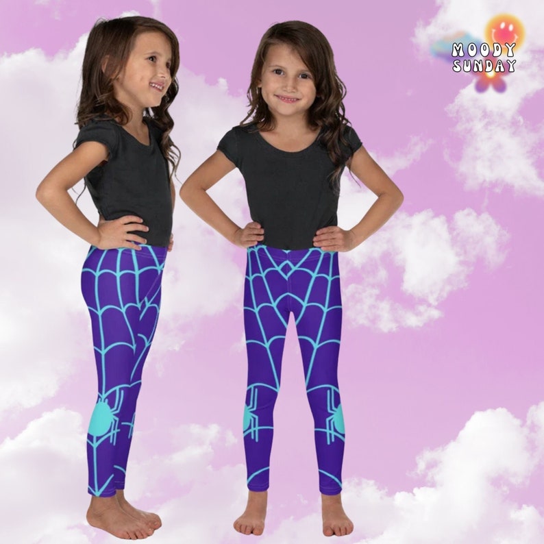 May include: Purple leggings with a blue spider web and spider design. The leggings are being modelled by a child.
