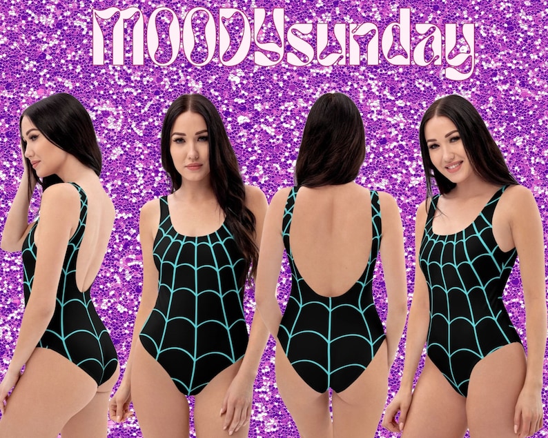May include: A black swimsuit with a turquoise spiderweb design. The swimsuit has a scoop neck and a low back.