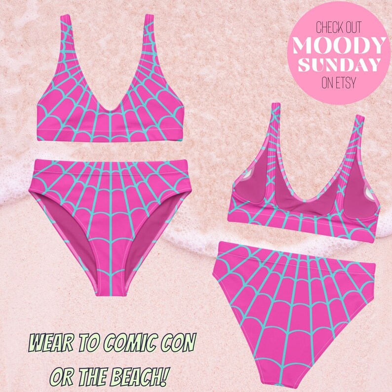 May include: A two-piece bikini set featuring a vibrant pink base with a light blue spider web pattern. The set includes a scoop-neck bikini top and high-waisted bikini bottoms, shown from both the front and back views on a sandy background.
