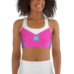 May include: Pink and white sports bra with a blue spider web design and a blue spider in the center.