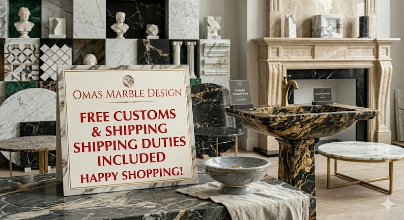 May include: A white rectangular sign with a gold border displays the text OMAS MARBLE DESIGN in dark red, followed by red text stating FREE CUSTOMS & SHIPPING SHIPPING DUTIES INCLUDED HAPPY SHOPPING! The sign sits on a black and gold marble surface.