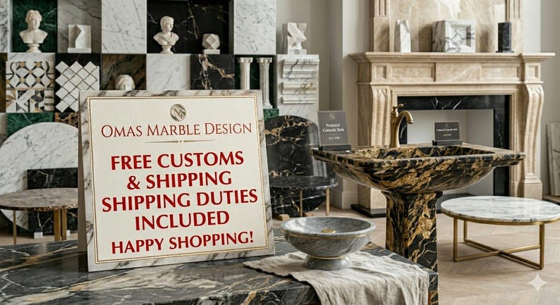 May include: A white rectangular sign with a gold border displays the text OMAS MARBLE DESIGN in dark red, followed by red text stating FREE CUSTOMS & SHIPPING SHIPPING DUTIES INCLUDED HAPPY SHOPPING! The sign sits on a black and gold marble surface.