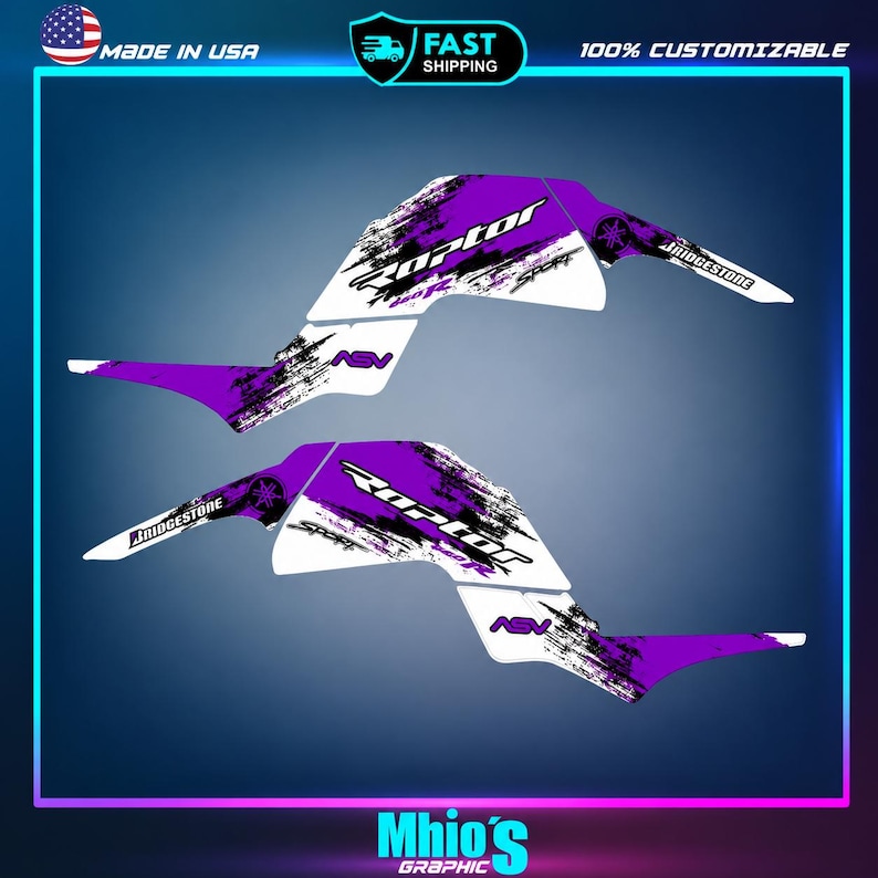 May include: A set of two white and purple vinyl decal stickers for a vehicle, featuring the text Raptor, 350R, Sport, ASV, and Bridgestone. The graphics include a distressed, splattered paint effect in purple and black across the white base.
