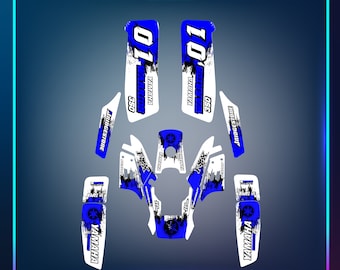 May include: Yamaha 350 dirt bike graphics kit in a blue and white colour scheme. The kit includes a number plate, side panels, and a front fender. The graphics feature the Yamaha logo, the number "01", and the words "Bridgestone" and "Taper".