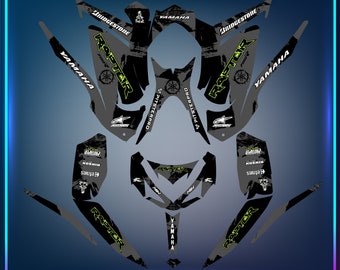 May include: A black and green graphic design for a Yamaha Raptor ATV. The design features the words "Raptor" and "Yamaha" in a stylised font, along with other graphics, including a skull and crossbones, a tyre track, and a PitsterPro logo.