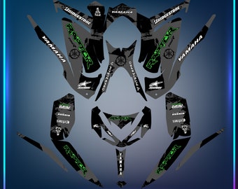May include: Black and green Yamaha Raptor 700 ATV graphics kit with a distressed look. The kit includes graphics for the front, sides, and rear of the ATV. The graphics feature the Yamaha logo, the Raptor logo, and the Bridgestone logo.