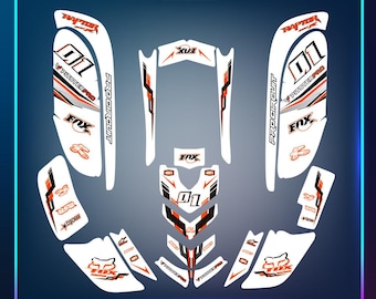 May include: A white and orange motorcycle graphic kit with the words "Pitster Pro", "Pro Circuit", "Fox", and "01" printed on it.