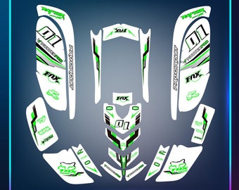 May include: Green and white motocross graphics kit with the words "Pitster Pro", "Pro Circuit", "Fox", and "Raptor" on it.