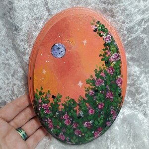 orange sky flower painting on wood