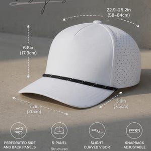 May include: White structured baseball cap with a curved visor and perforated side panels. Features a black rope detail and snapback adjustment. The cap measures 22.9-25.2 inches (58-64cm) in circumference, 6.8 inches (17.3cm) high, and 7.7 inches (20cm) wide.