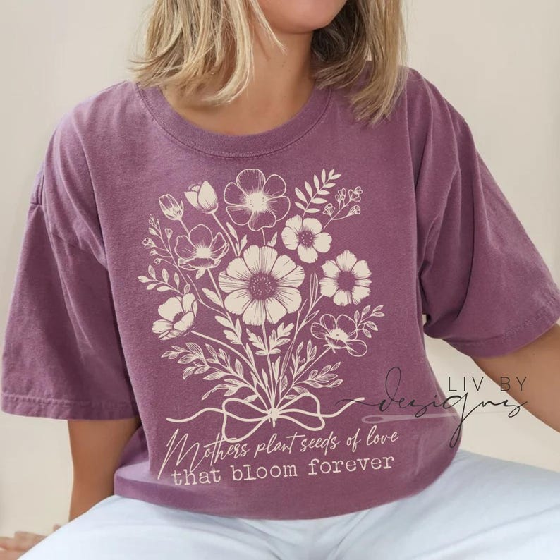 Woman wearing vintage washed Comfort Colors Mother's Day shirt with floral DTF design