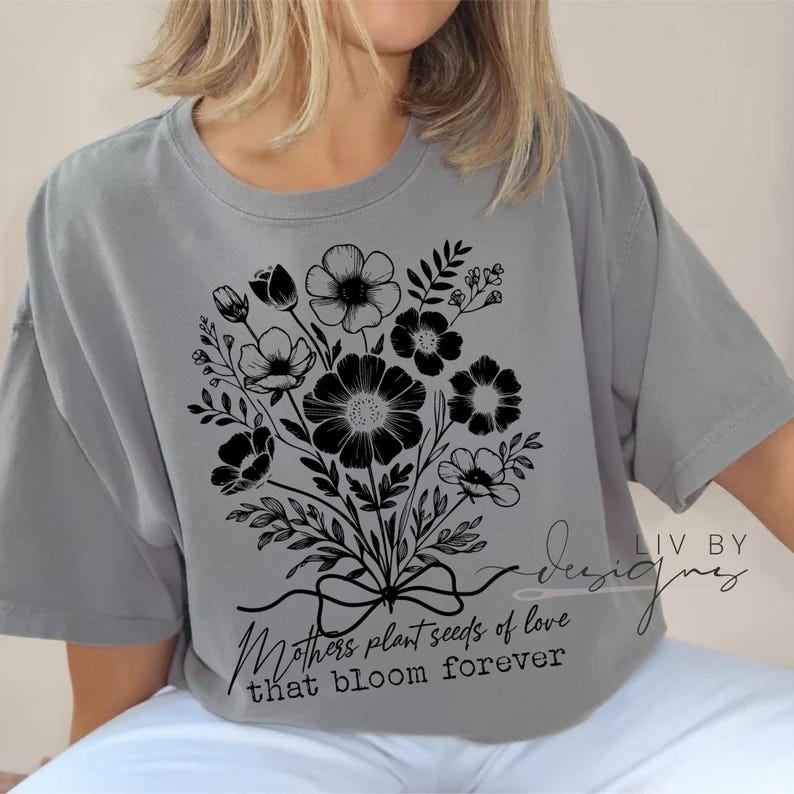 Close-up of black floral DTF print on Comfort Colors light grey t-shirt