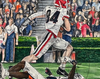 UGA footbal player running over Auburn football player/"McConkey Posterizes Pritchett"