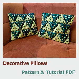 May include: Two decorative pillows with a geometric pattern of green and yellow triangles. The pillows are on a brown couch. The text "Decorative Pillows Pattern & Tutorial PDF" is below the image.