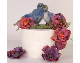 Where lovebirds meet wildflowers — a charming, one-of-a-kind wedding cake topper your family will pass down for generations.
