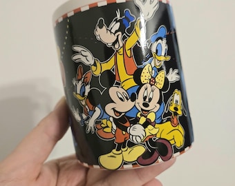 Disney mug with classic Disney characters  including Pluto, Mickey, Minnie, Donald Duck, Goofy and more, in excellent condition.