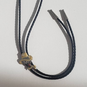 Beautiful bolo tie with the face of a lady wearing a cowboy hat