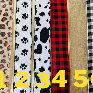 May include: Six different types of ribbon, each with a different pattern. The ribbons are numbered 1 through 6. The patterns include leopard print, paw prints, cow print, plaid, burlap, and gingham.