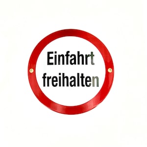 May include: A red circle sign with white text that reads "Einfahrt freihalten".