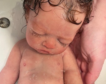 full body silicone reborn baby girl.Please read all descriptions. Comes with exciting box opening. Wait times may take  4-6months