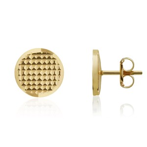 May include: A pair of gold-colored stud earrings. Each earring is a flat, textured circle with a geometric pattern. One earring is shown from the side, displaying the post and backing. The earrings are displayed on a white background.