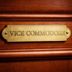 May include: A handmade wooden sign with the text "Welcome" in a handwritten style. The sign is painted white with a distressed finish and features a small, decorative heart. It is designed for indoor or outdoor use.