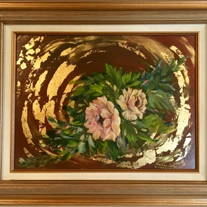 May include: A painting of pink flowers with green leaves on a brown background with gold accents. The painting is framed in a gold frame.