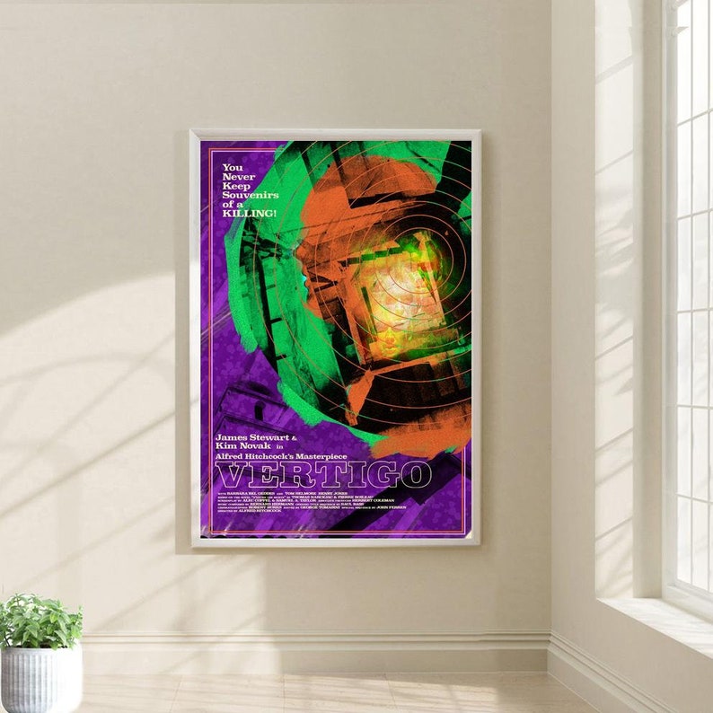 May include: A vintage movie poster for the film Vertigo, featuring a colorful abstract design with a circular pattern in the center. The poster includes the title "VERTIGO" in large, bold letters and the text "You Never Keep Souvenirs of a KILLING!" in smaller letters. The poster also features the names of the actors, James Stewart and Kim Novak, and the director, Alfred Hitchcock.